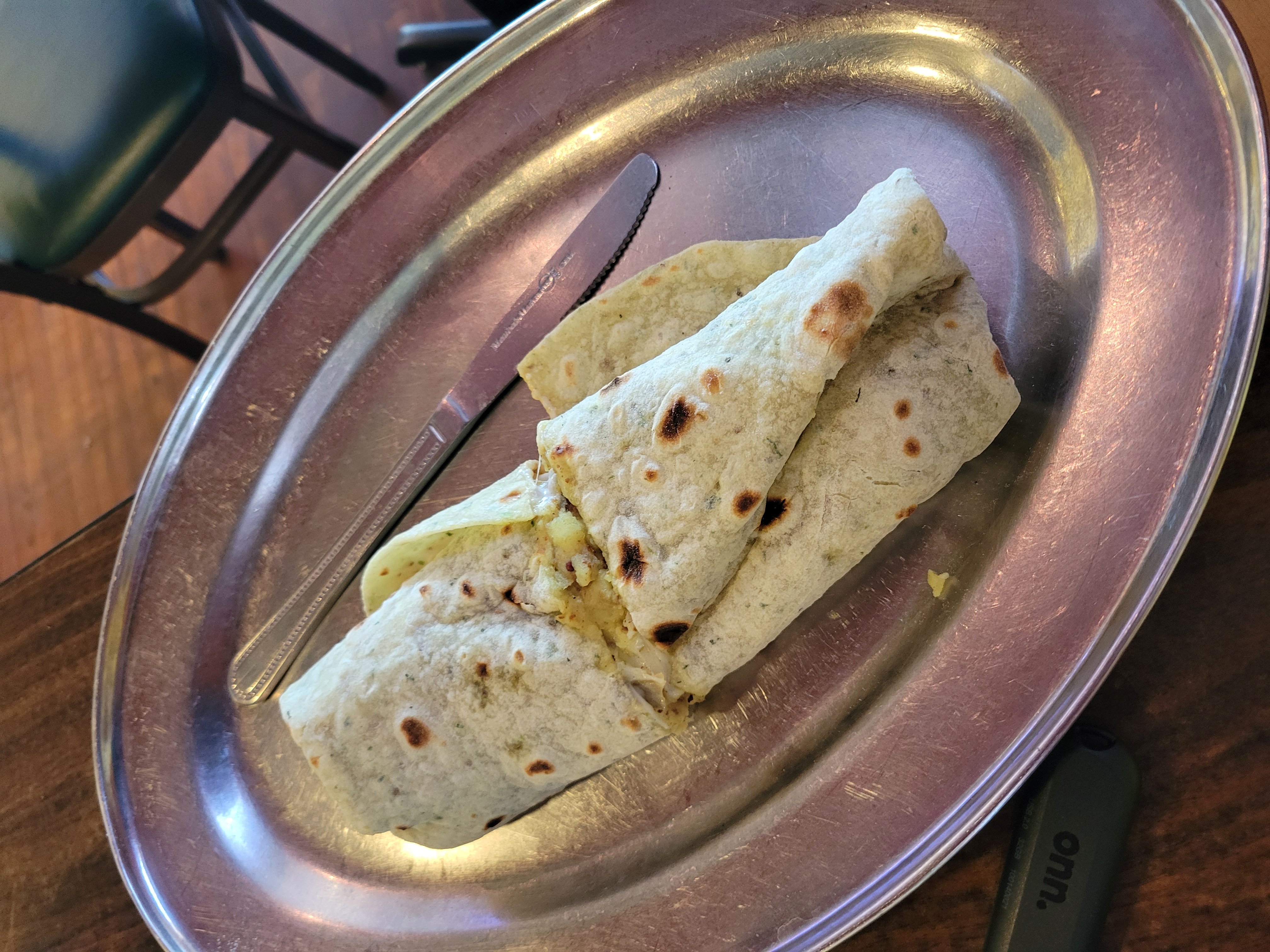 Mumbai frankie with a knife on a plate